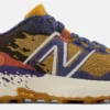 Trailrunning Schoen New Balance Women Fresh Foam X Hierro V7 Golden Hour Moon Shadow Red Clay