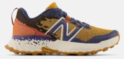 Trailrunning Schoen New Balance Women Fresh Foam X Hierro V7 Golden Hour Moon Shadow Red Clay